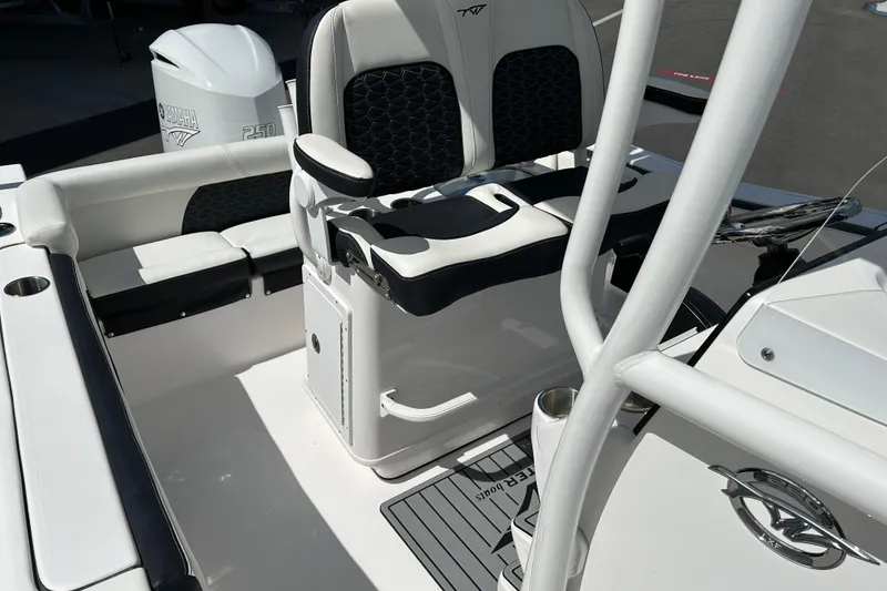 Slide: The Image of 2024 Tidewater 220 LXF boat interior with Yamaha 250 engine, featuring sleek seating and modern design. - 12