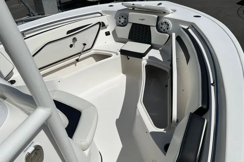 Slide: The Image of 2024 Tidewater 220 LXF boat interior with seating and storage compartments. - 14