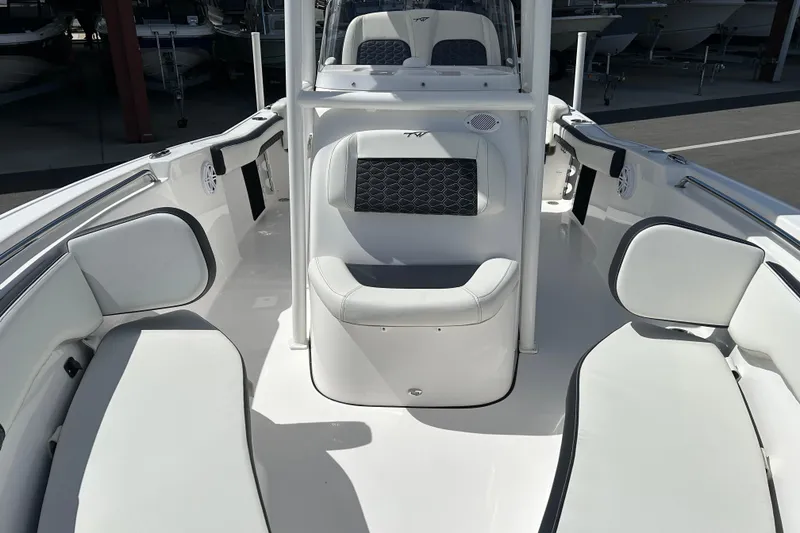 Slide: The Image of 2024 Tidewater 220 LXF boat interior with white seating and modern design. - 9