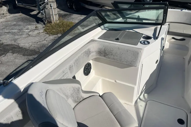 Slide: The Image of 2020 Sea Ray SPX 210 boat interior with seating and dashboard details. - 9