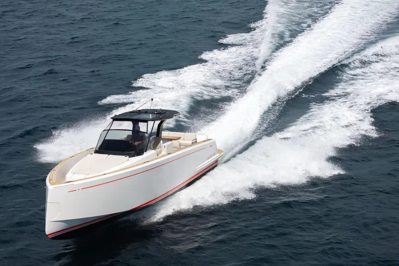 Slide: The Image of 2021 Pardo Yachts 38 cruising on open water, creating a dynamic wake. - 4