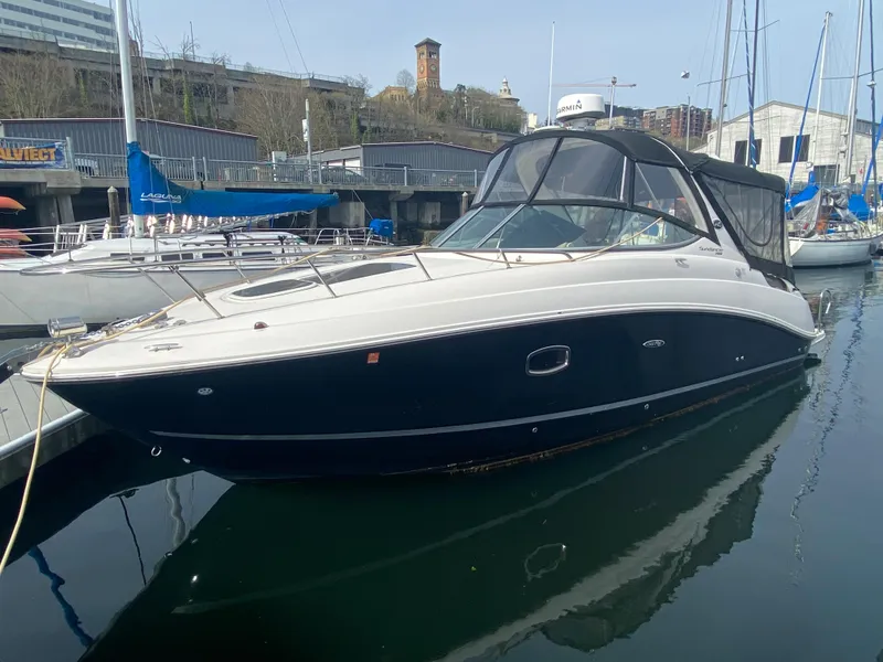 The Image of 2012 Sea Ray Sundancer 280 docked, sleek design. - 0