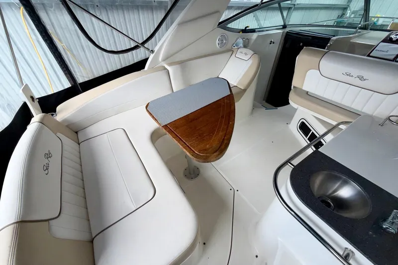 Slide: The Image of Interior of 2012 Sea Ray Sundancer 280 boat with seating and table. - 14