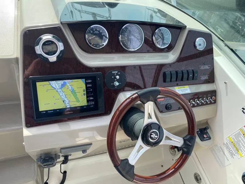 Slide: The Image of Dashboard of 2012 Sea Ray Sundancer 280 with navigation system. - 19