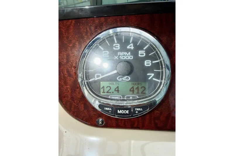 Slide: The Image of Close-up of Sea Ray Sundancer 280 tachometer showing 12.4 volts and 412 hours. - 20