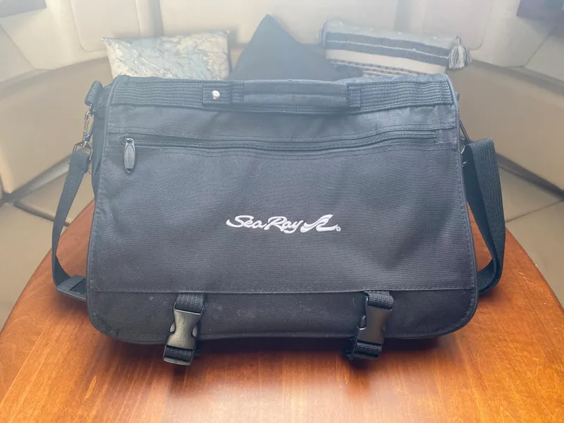 Slide: The Image of Black Sea Ray bag on wooden table, Sundancer 280, 2012. - 27