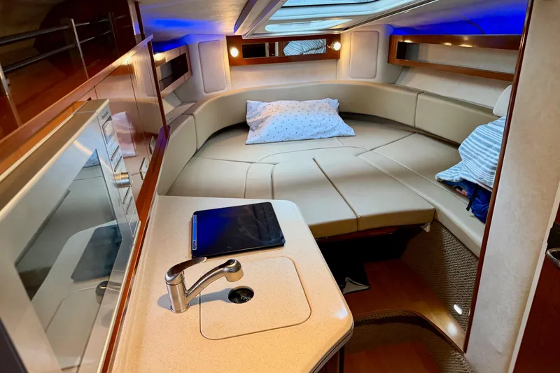 Slide: The Image of Luxurious interior of 2012 Sea Ray Sundancer 280 with cozy seating and modern amenities. - 28