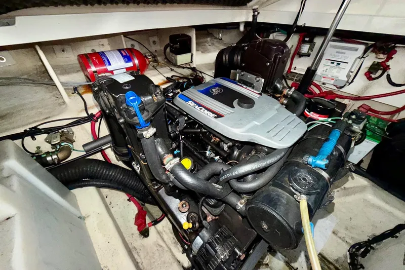 Slide: The Image of Engine compartment of 2012 Sea Ray Sundancer 280 boat, showcasing detailed mechanical components. - 46