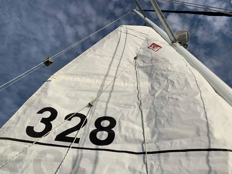 Slide: The Image of Mainsail of a 1992 Catalina 42 yacht with number 328. - 15