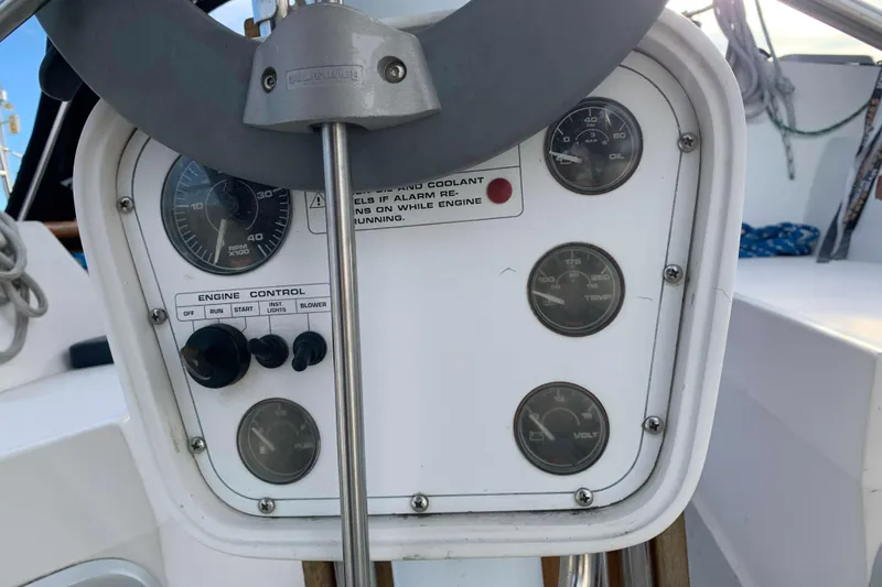 Slide: The Image of Dashboard of a 1992 Catalina 42 yacht with steering wheel and gauges. - 18