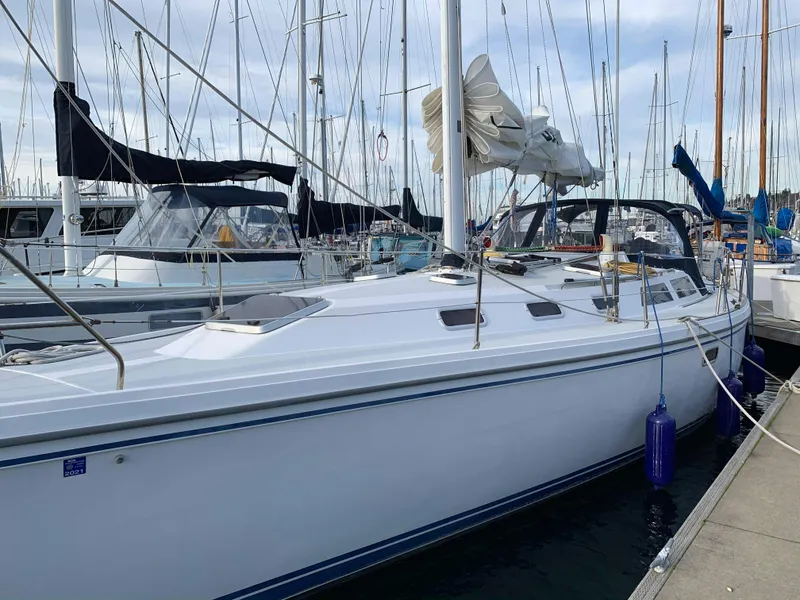 Slide: The Image of 1992 Catalina 42 sailboat docked in marina. - 2
