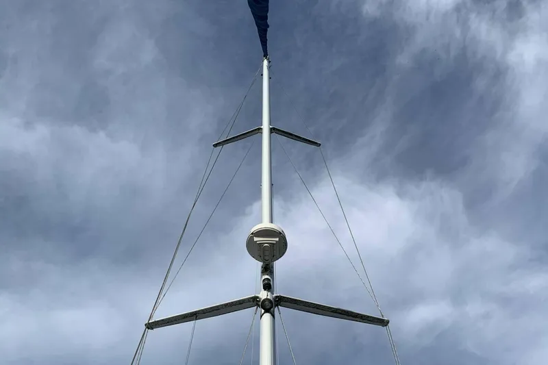 Slide: The Image of Mast of a 1992 Catalina 42 sailboat against a cloudy sky. - 21