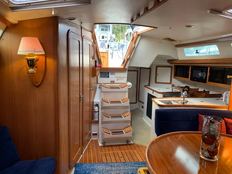 Slide: The Image of Interior of a 1992 Catalina 42 yacht with wooden furnishings. - 28