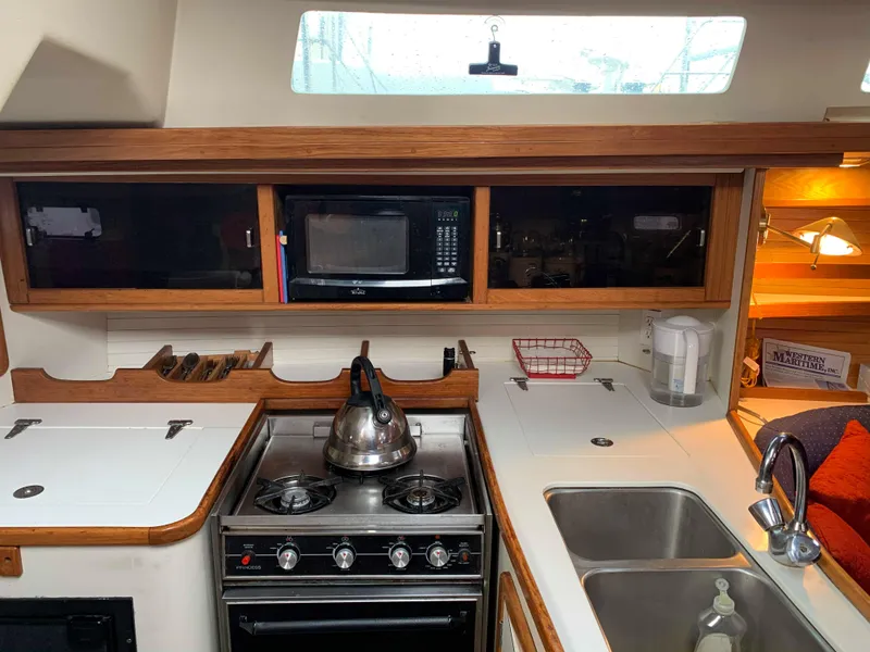 Slide: The Image of Interior of 1992 Catalina 42 yacht kitchen with stove and sink. - 30