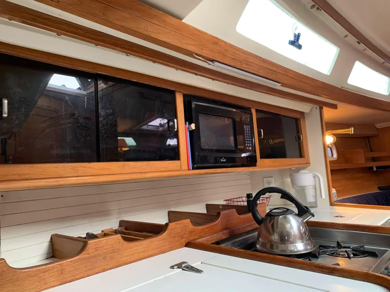 Slide: The Image of Interior of a Catalina 42 yacht kitchen with kettle and microwave. - 35