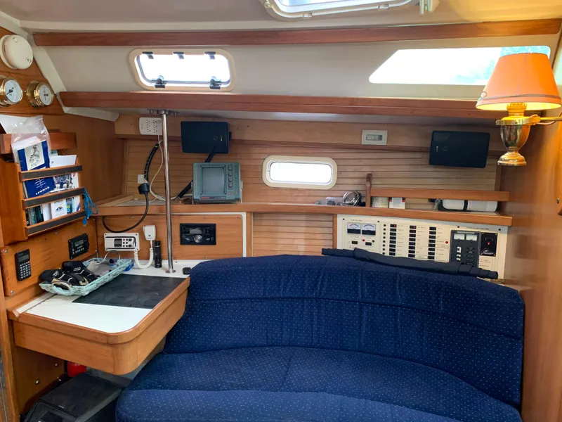 Slide: The Image of Interior of a 1992 Catalina 42 yacht with blue couch. - 45