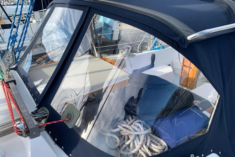 Slide: The Image of 1992 Catalina 42 sailboat cockpit with ropes and cover. - 9