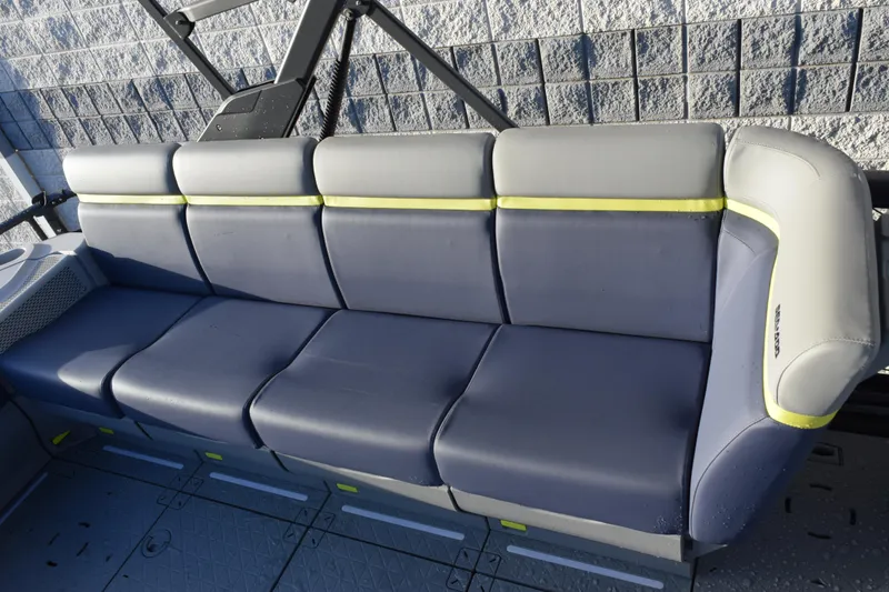 Slide: The Image of 2026 Sea-Doo Switch Cruise Limited 21 boat seating, gray and yellow upholstery. - 11