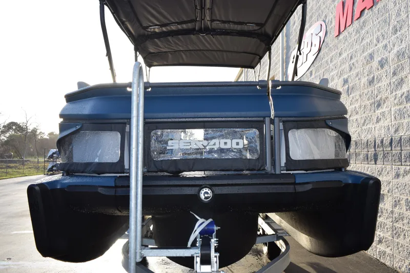 Slide: The Image of 2026 Sea-Doo Switch Cruise Limited 21 pontoon boat on trailer, rear view. - 3