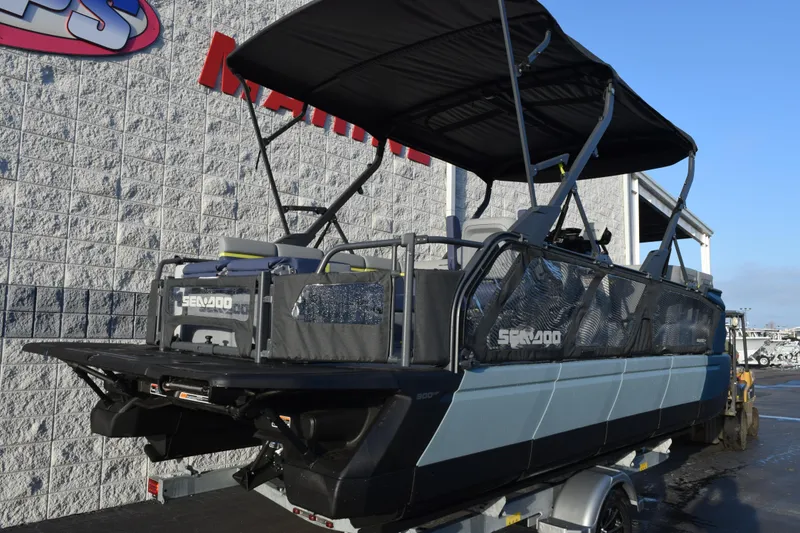 Slide: The Image of 2026 Sea-Doo Switch Cruise Limited 21 pontoon boat on trailer, side view. - 4