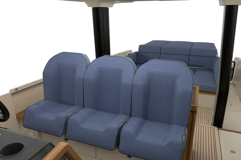 Slide: The Image of Interior seating of 2026 Aiata Sunfinder 50 boat with blue cushioned seats. - 11