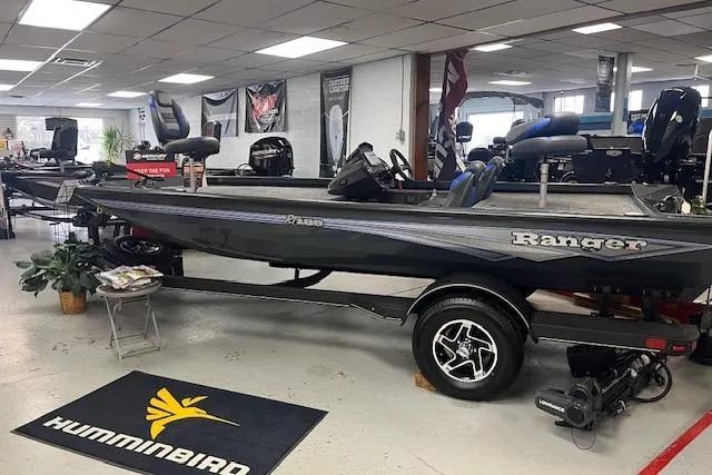 Slide: The Image of 2026 Ranger RT188 boat displayed in showroom with Humminbird mat. - 1