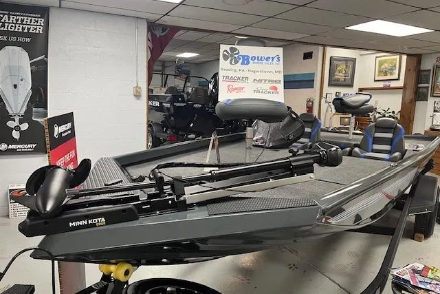 Slide: The Image of 2026 Ranger RT188 fishing boat with Minn Kota trolling motor in showroom display. - 4