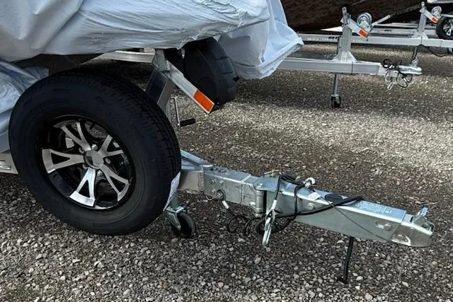 Slide: The Image of Trailer hitch and wheel of 2026 Express H20C on gravel surface. - 10