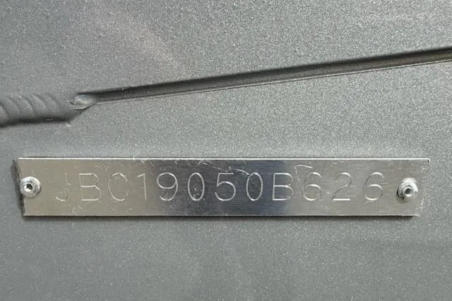 Slide: The Image of Metallic identification plate on Express H20C, 2026 model, with engraved serial number. - 13