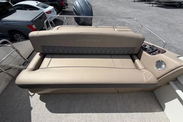 Slide: The Image of 2021 Bennington QX 25 QXSBWA boat with beige seating and cup holders. - 11