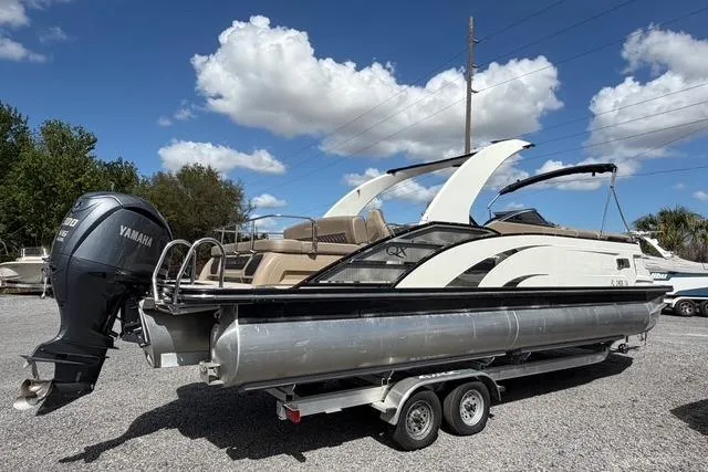 Slide: The Image of 2021 Bennington QX 25 QXSBWA pontoon boat with Yamaha engine on trailer. - 6