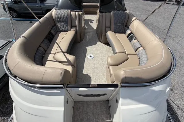 Slide: The Image of 2021 Bennington QX 25 QXSBWA pontoon boat with luxurious beige seating and spacious interior. - 9