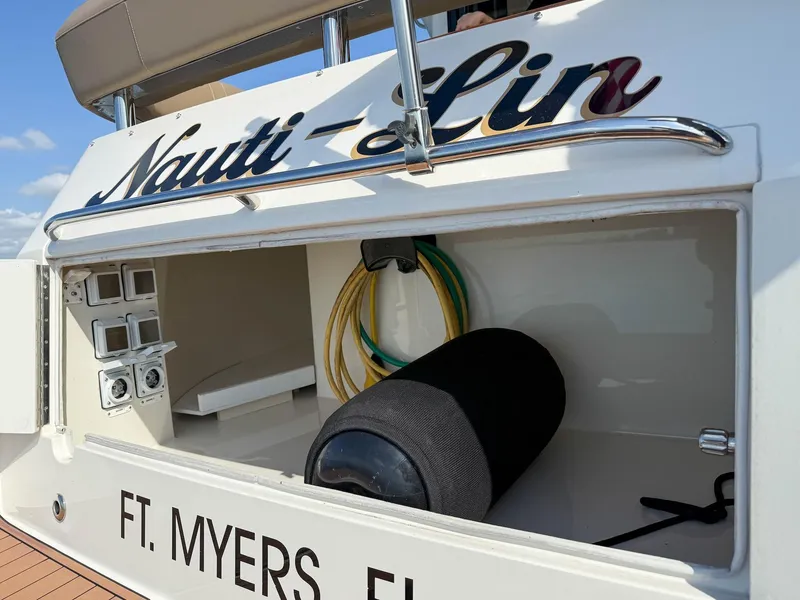 Slide: The Image of 2016 Carver C37 Coupe boat stern with storage compartment, docked in Ft. Myers, FL. - 16