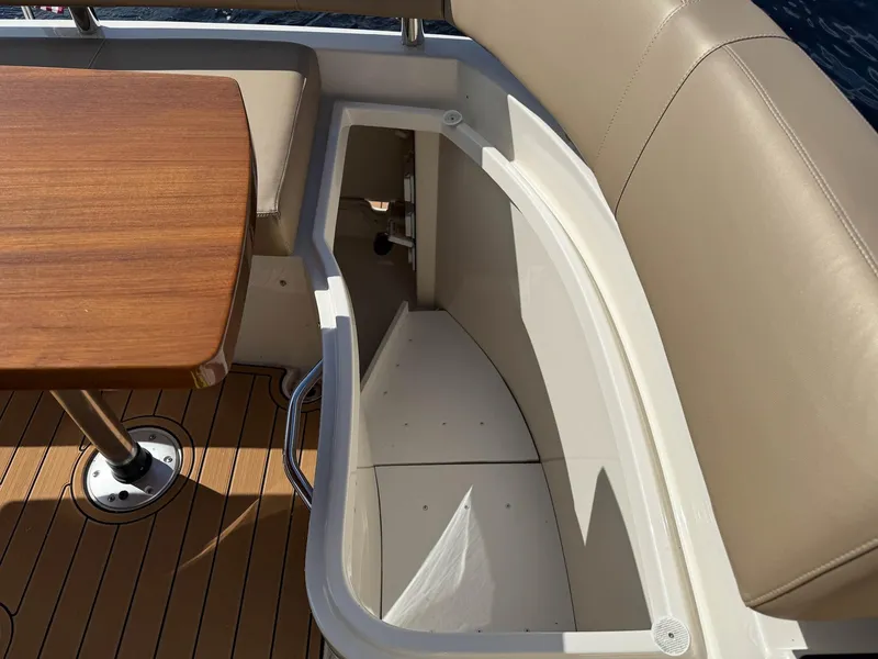 Slide: The Image of Interior seating and table on a 2016 Carver C37 Coupe yacht. - 25