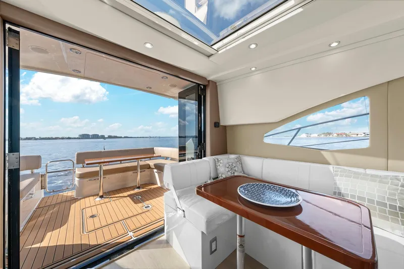 Slide: The Image of Interior of 2016 Carver C37 Coupe yacht with open deck view. - 32