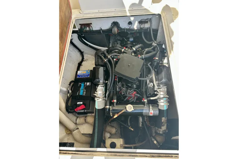 Slide: The Image of Engine compartment of a 1985 Bertram 28 Bahia Mar boat, showcasing mechanical components. - 4