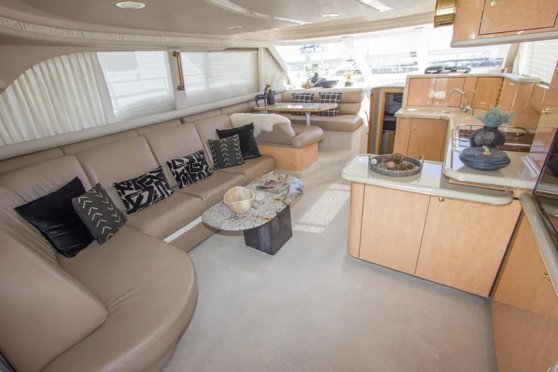 Slide: The Image of Luxurious interior of 1998 Sea Ray 480 Sedan Bridge yacht with elegant seating and modern decor. - 10