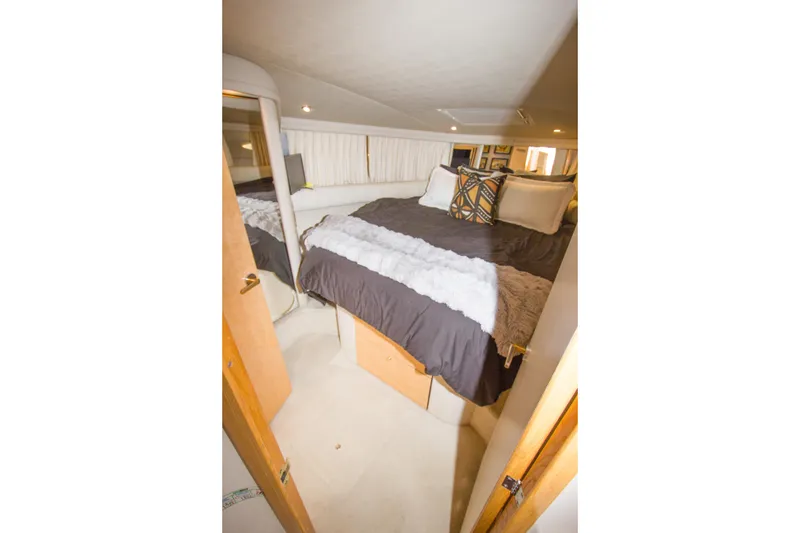 Slide: The Image of Luxurious bedroom interior of 1998 Sea Ray 480 Sedan Bridge yacht. - 26