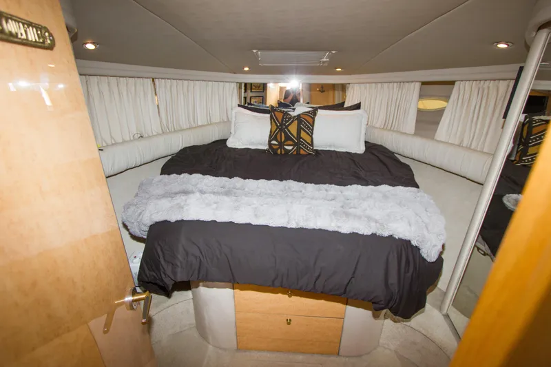 Slide: The Image of Luxurious bedroom interior of 1998 Sea Ray 480 Sedan Bridge yacht. - 27