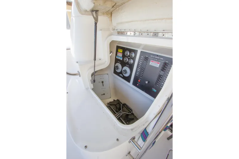 Slide: The Image of 1998 Sea Ray 480 Sedan Bridge control panel with gauges and switches. - 34