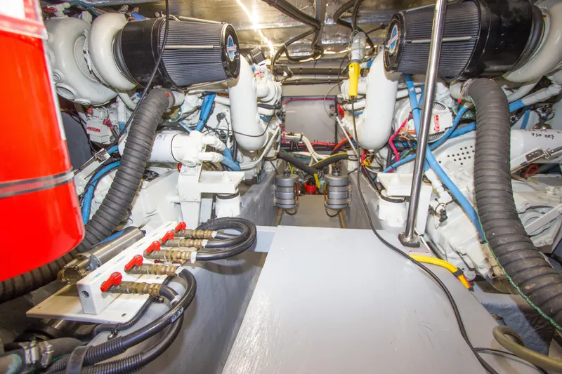 Slide: The Image of Engine room of 1998 Sea Ray 480 Sedan Bridge, showcasing mechanical components and wiring. - 36