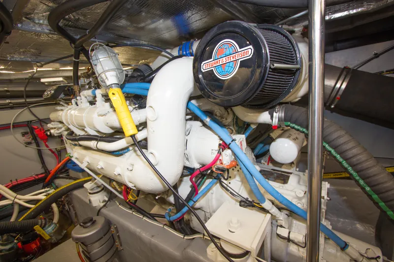 Slide: The Image of Engine room of 1998 Sea Ray 480 Sedan Bridge with visible components and wiring. - 38