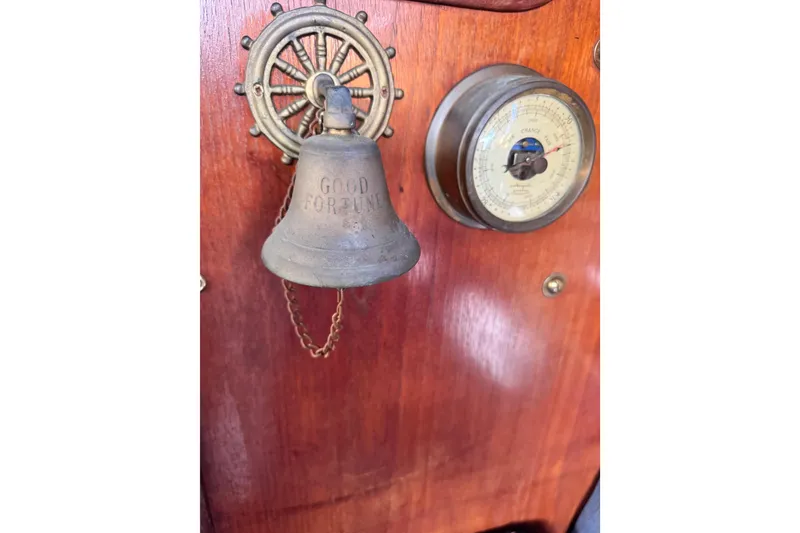 Slide: The Image of Vintage bell and barometer on 1981 Catalina 30 sailboat interior. - 16