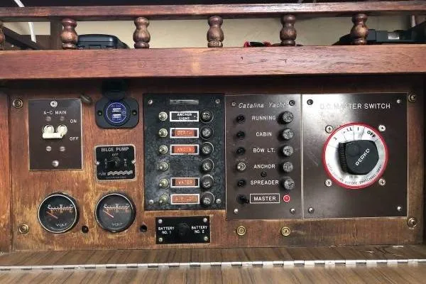 Slide: The Image of Electrical control panel of a 1981 Catalina 30 yacht with switches and gauges. - 17