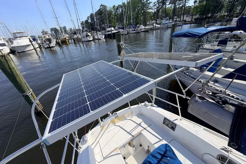 Slide: The Image of Origo 3000 stove in a 1981 Catalina 30 sailboat galley, featuring control knobs and safety instructions. - 26