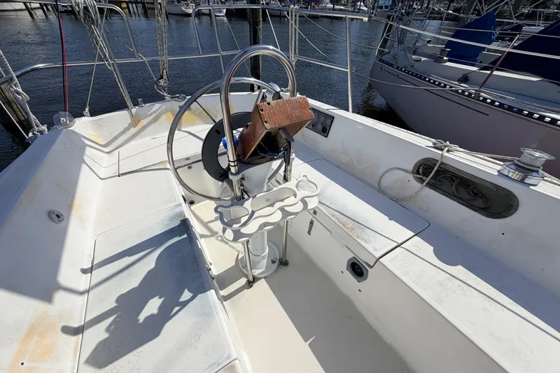 Slide: The Image of Interior of 1981 Catalina 30 sailboat with radio equipment and emergency instructions. - 34