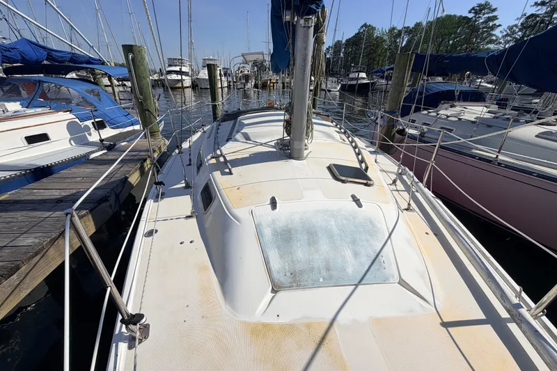 Slide: The Image of Interior of a 1981 Catalina 30 sailboat with navigation station and seating area. - 40
