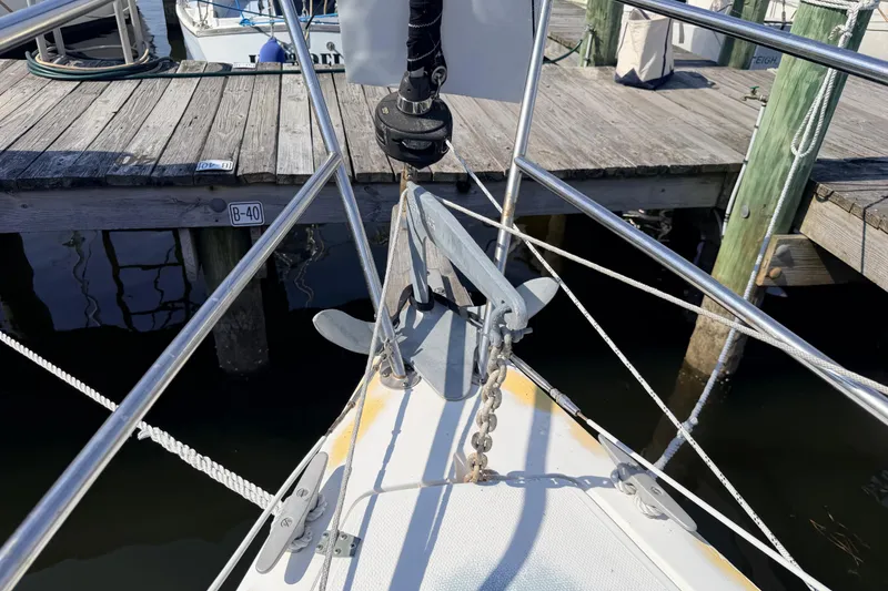 Slide: The Image of Interior of 1981 Catalina 30 sailboat featuring kitchen area with stove and sink. - 42