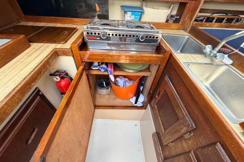 Slide: The Image of White ventilation cover on 1981 Catalina 30 boat interior, mounted on wooden panel. - 46