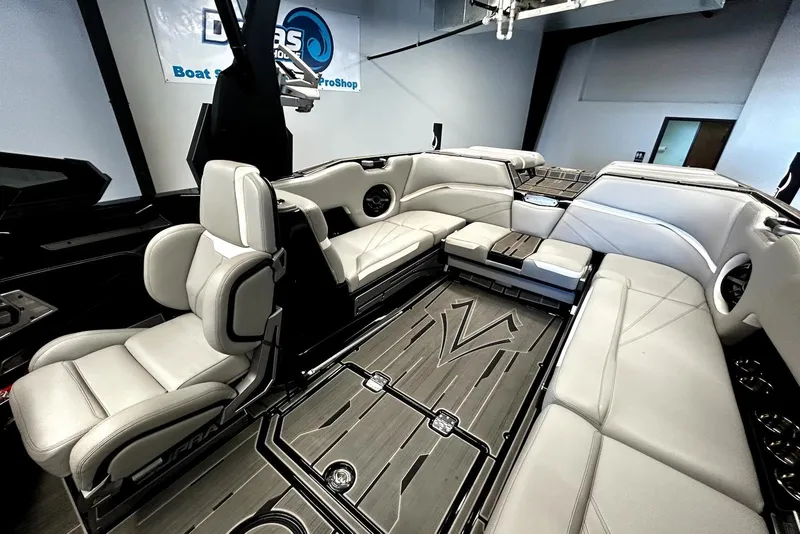 Slide: The Image of 2023 Supra SA 450 boat interior with luxurious seating and modern design. - 2